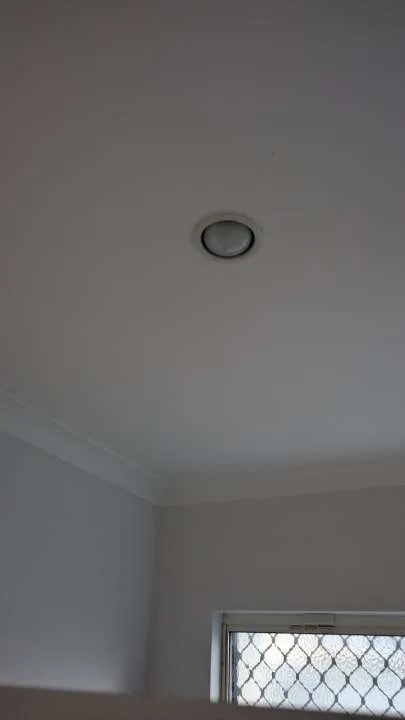 Illuminated recessed ceiling lights in a finished interior